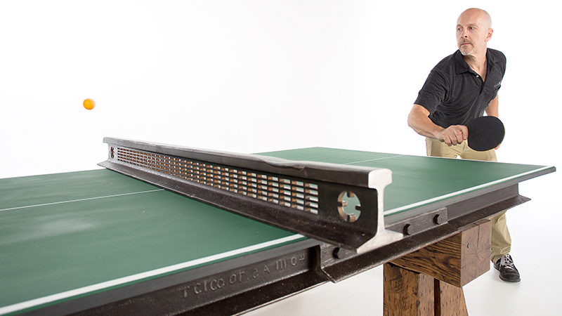 Illustration for article titled Steel and Wood From a Salvaged Railroad Support This Rustic Ping Pong Table